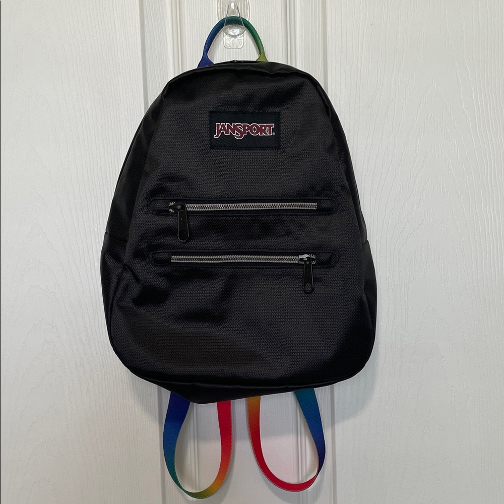 JanSport Half Pint 2 FX Mini Backpack featuring distinctive rainbow webbing.